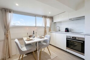 Superior Studio Suite, City View | Living area | 80-cm Smart TV with digital channels - TRONCHET (Paris)