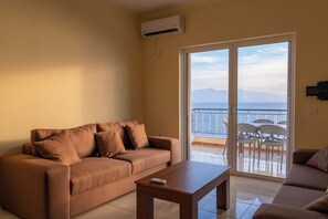 Apartment | Living area | 15-inch flat-screen TV with satellite channels - StarLight Apartments 1 (Sarande)
