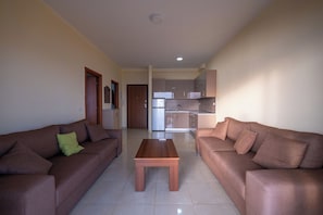 Apartment | Living area | 15-inch flat-screen TV with satellite channels - StarLight Apartments 1 (Sarande)