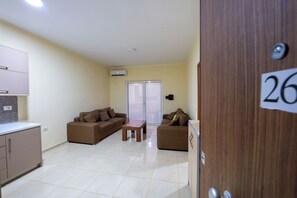 Apartment | Living area | 15-inch flat-screen TV with satellite channels - StarLight Apartments 1 (Sarande)