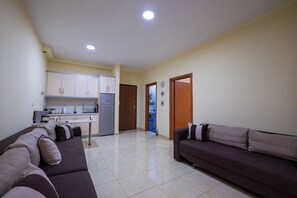 Apartment | Living area | 15-inch flat-screen TV with satellite channels - StarLight Apartments 1 (Sarande)