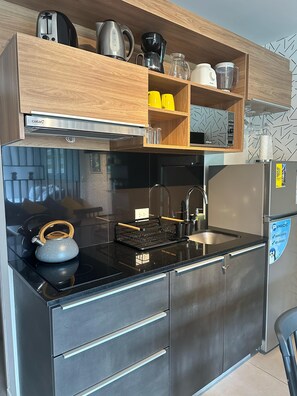 Fridge, microwave, stovetop, coffee/tea maker