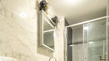 Shower, hair dryer, towels, soap