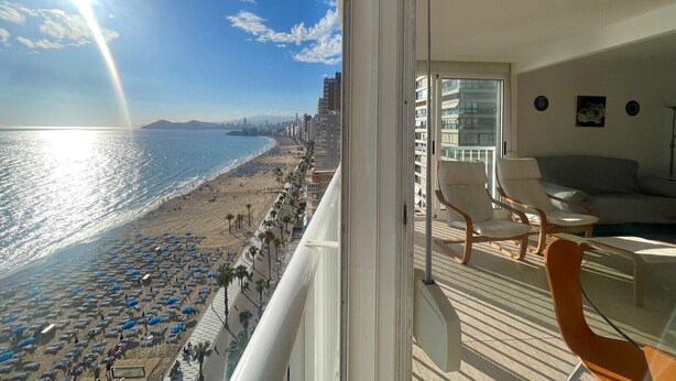 A balcony with a view of a beach and city skyline. - TORRE YAGO SEAFRONT LEVANTE N028 (Benidorm)