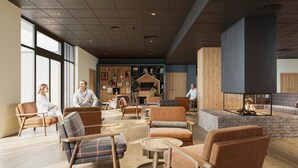 A spacious lobby with multiple seating areas, a fireplace, and a wall adorned with various artworks. - Wifi, swimming pool, sauna, hammam, balcony, tv, ski locker, 44-53m², Serre Chevalier (La Salle-les-Alpes)