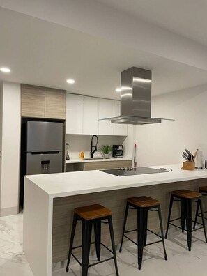 Fridge, microwave, stovetop, coffee/tea maker