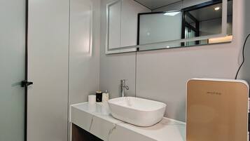 Shower, free toiletries, hair dryer, slippers