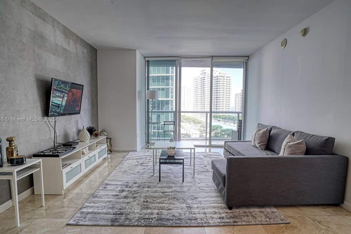 Superior Apartment | Living area | 150-inch Smart TV with satellite channels, Netflix, streaming services