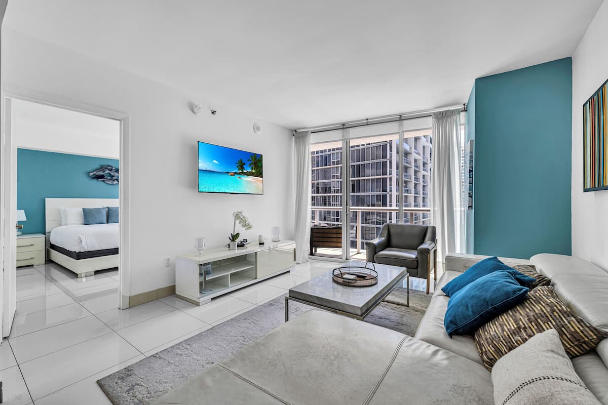 Premium Apartment | Living area | 150-inch Smart TV with satellite channels, Netflix, streaming services