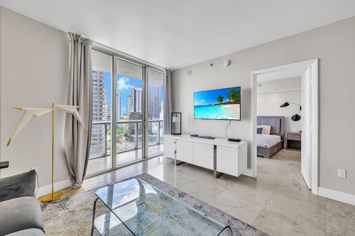 Comfort Apartment | Living area | 150-inch Smart TV with satellite channels, Netflix, streaming services