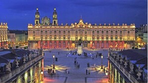 A large, historic building with a central courtyard and a statue in the middle. - Hotel Les Portes D'Or (Nancy)
