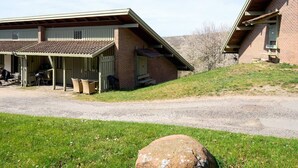 A building with a covered patio area and a brick exterior. - 4 Star Holiday Home in Allinge (Allinge)