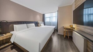 A hotel room with a large bed, a desk, and a TV. - HanTing Premium Hotel (Beijing Jinsong Subway Station) (Beijing)