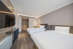 A hotel room with two beds, a desk, a mirror, and a nightstand. - HanTing Premium Hotel (Beijing Jinsong Subway Station) (Beijing)