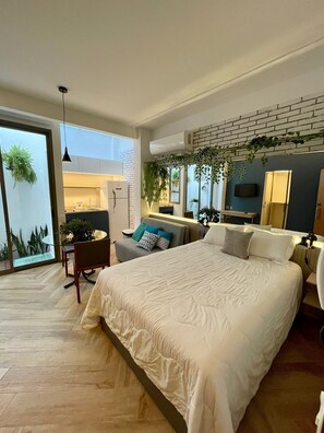 Comfort Studio, Patio | In-room safe, desk, laptop workspace, iron/ironing board