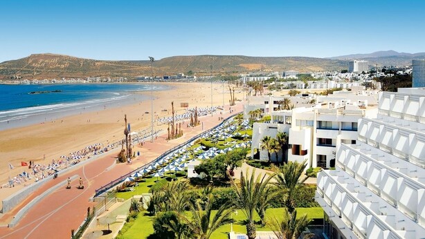 A coastal hotel with a beach view, a running track, and a landscaped garden. - Agadir Bay Beautiful apartment overlooking the pool and nearby beach. (Agadir)
