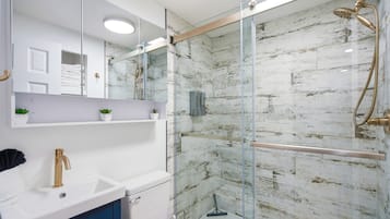 Shower, hair dryer, towels, soap