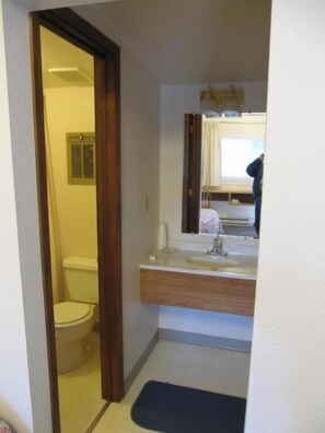 Combined shower/tub, hair dryer, towels, soap