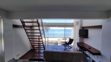 Deluxe Studio, Balcony, Lake View | Living area | TV