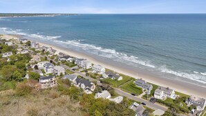 A coastal residential area with houses along the beach, clear skies, and a view of the ocean. - Drakes Island! Ocean Views!- Across from Drake's Island Beach! (Wells)