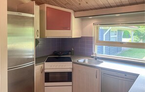 Fridge, stovetop, dishwasher, coffee/tea maker