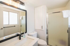 Shower, hair dryer, towels, toilet paper