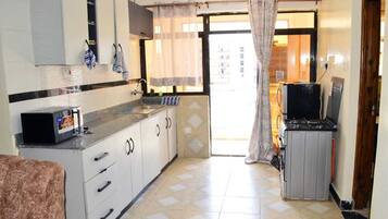 Fridge, microwave, oven, cookware/dishes/utensils