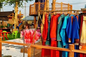 A clothing stall with various garments displayed. - Ergun Shiwei Lanxin Dream Home (Ergun)