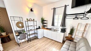 A modern kitchen with white cabinets, a built-in sink, and a small refrigerator. - Studio 'Aeolian Blu 11' with Sea View, Wi-Fi and Air Conditioning (Paros)