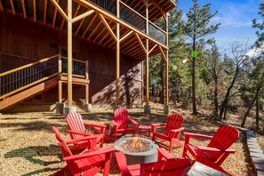 A wooden cabin with a deck, outdoor seating, and a fire pit. - Shem Shack (Big Bear City)