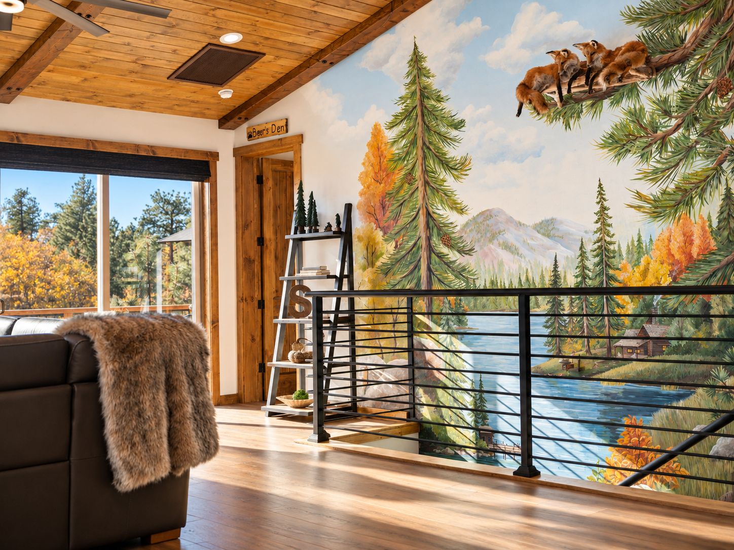 A room with a mural of a forest scene, a wooden ceiling, a sofa with a fur throw, and a view of a lake through a window.
