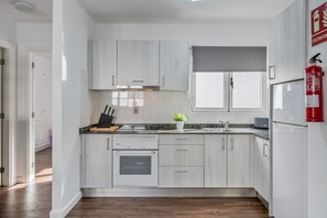 Fridge, microwave, stovetop, coffee/tea maker