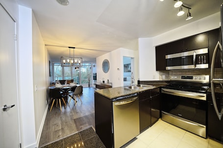 Economy Studio Suite | Private kitchen | Coffee/tea maker, electric kettle, toaster, paper towels