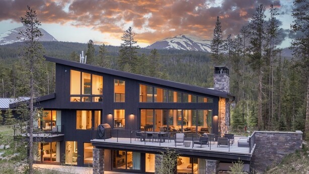 A modern two-story house with large windows and a deck, surrounded by forest and mountains. - Spectacular Views, Close to town, Mountain Modern elegance and entertaining! (Blue River)