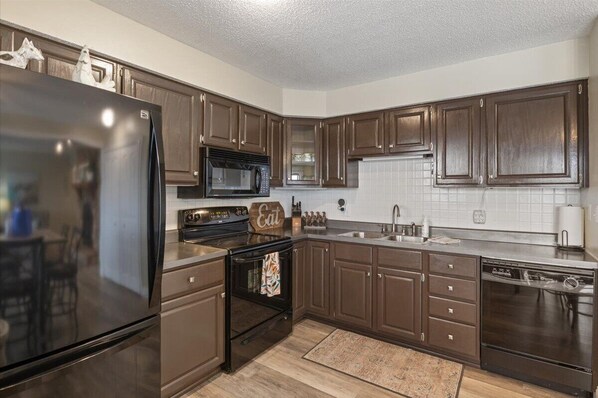 Fridge, microwave, oven, stovetop - Lakefront Osage Beach Condo + Workspace w/ Pool Views (Osage Beach)