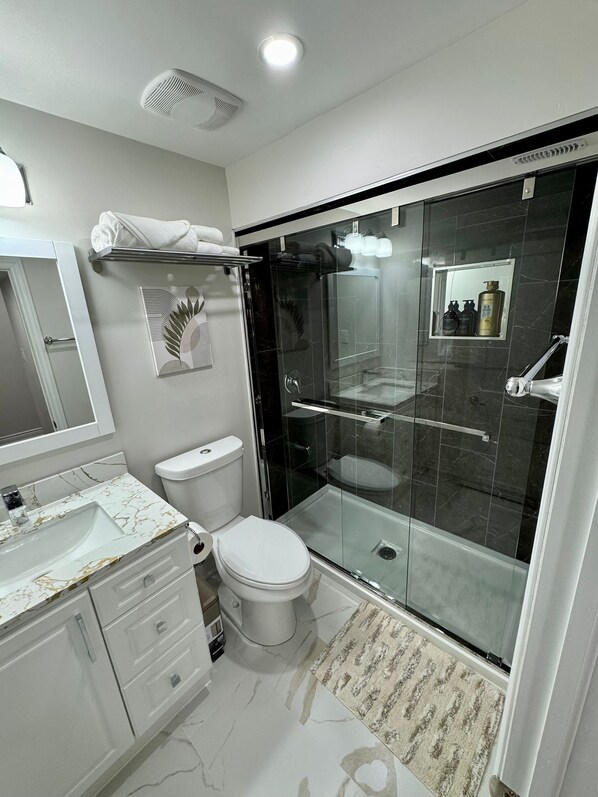 Shower, hair dryer, towels, soap