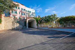 A parking area leading to a building with a stone facade and a staircase. - Seaview Pool Retreat  - M20, Andora, Italy (Andora)