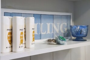 Hair dryer, towels, soap, toilet paper