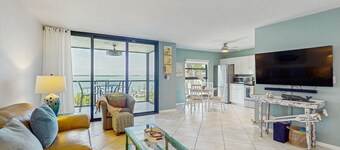 Condo retreat with private balcony, patio furniture, and amazing ocean views