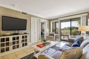 TV, books - Family Friendly Condo, outdoor/ indoor pool, hot tub, close to beach (Hilton Head)