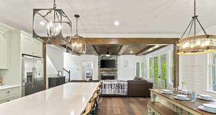 Modern lakefront retreat with private dock, game room, grill, & boat access