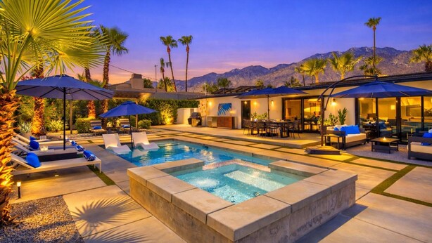 A pool area with lounge chairs and umbrellas, a hot tub, and a view of mountains. - Private Pool and Spa in Palm Springs with Mountain Views and Designer Interiors (Palm Springs)