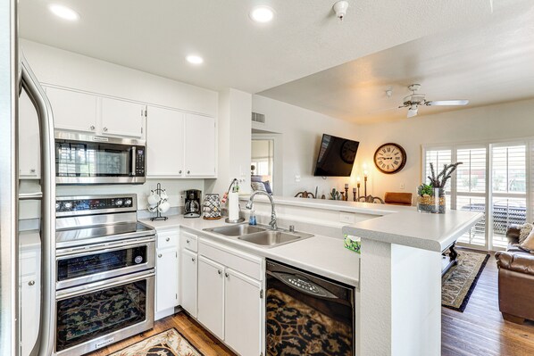 Fridge, stovetop, dishwasher, coffee/tea maker