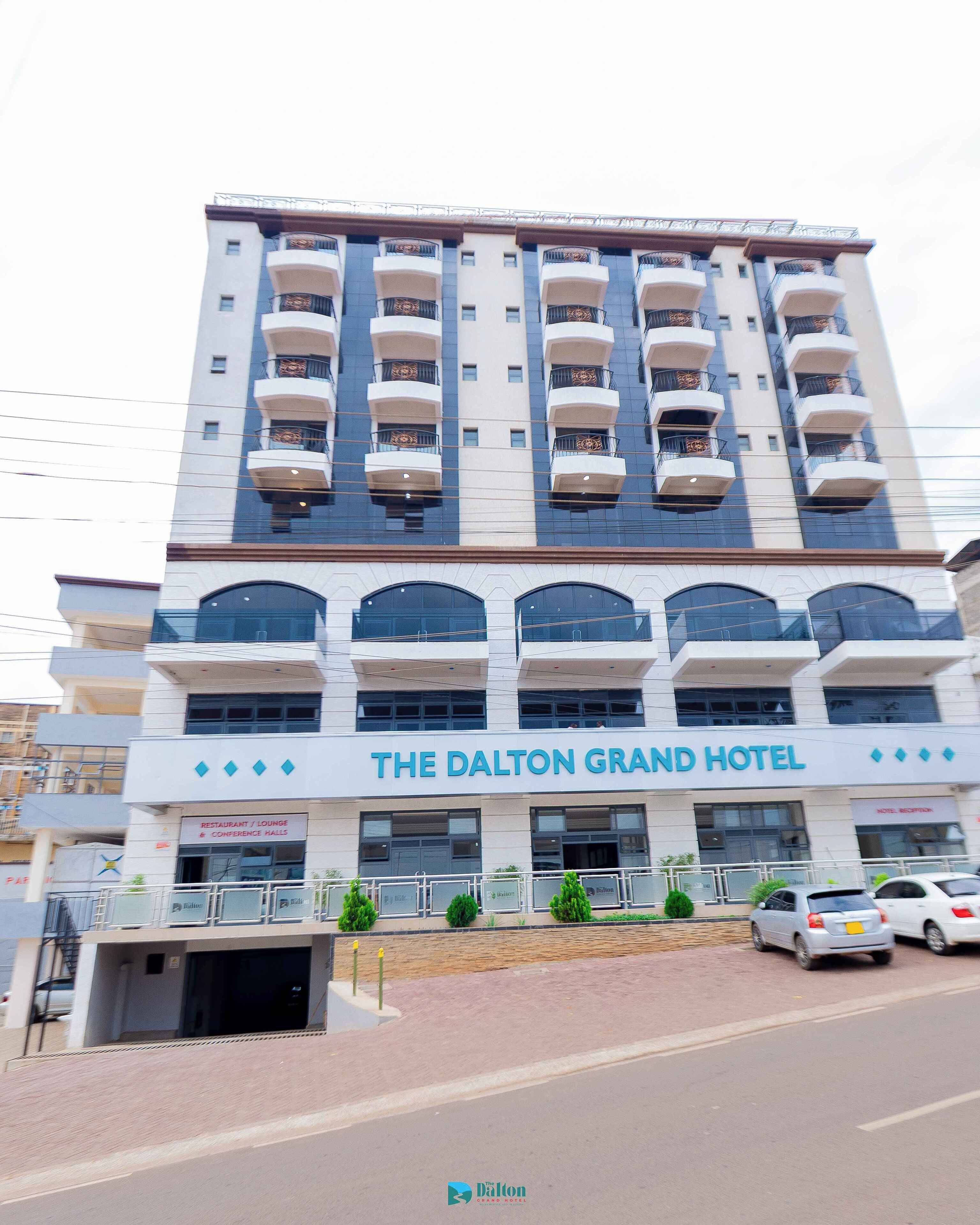A multi-story hotel with a sign reading "The Dalton Grand Hotel".