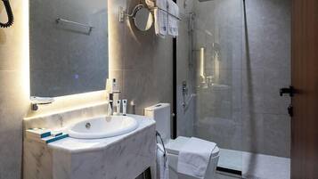 Separate bathtub and shower, free toiletries, hair dryer, slippers