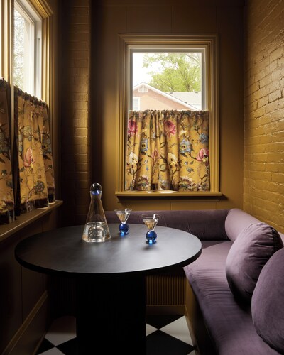 This neutral flat packs a punch with a unique and interesting feature—a round king size bed!