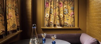 This neutral flat packs a punch with a unique and interesting feature—a round king size bed!