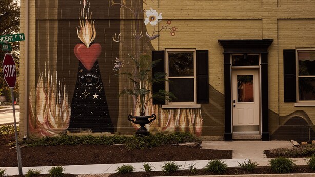 A building with a mural of a hotel named 'Hotel Julie' on its facade. - Designed for the solo traveller or couple looking for a taste of the Hotel Julie experience. (Stratford)