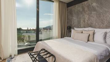 Luxury Suite, Sea View | Minibar, in-room safe, desk, laptop workspace