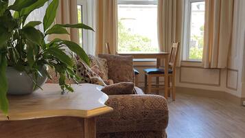 Apartment 3 - Double bed | Living area | 40-inch Smart TV with cable channels